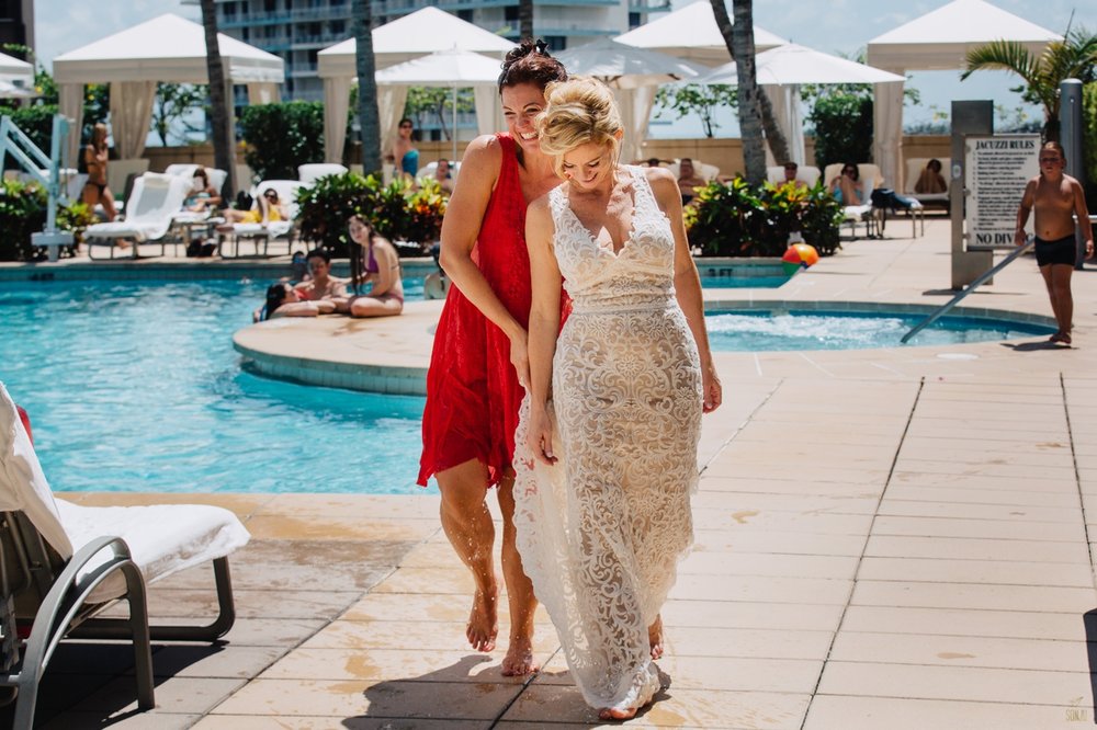 Bride in pool at Four Seasons Miami Brickell Wedding 