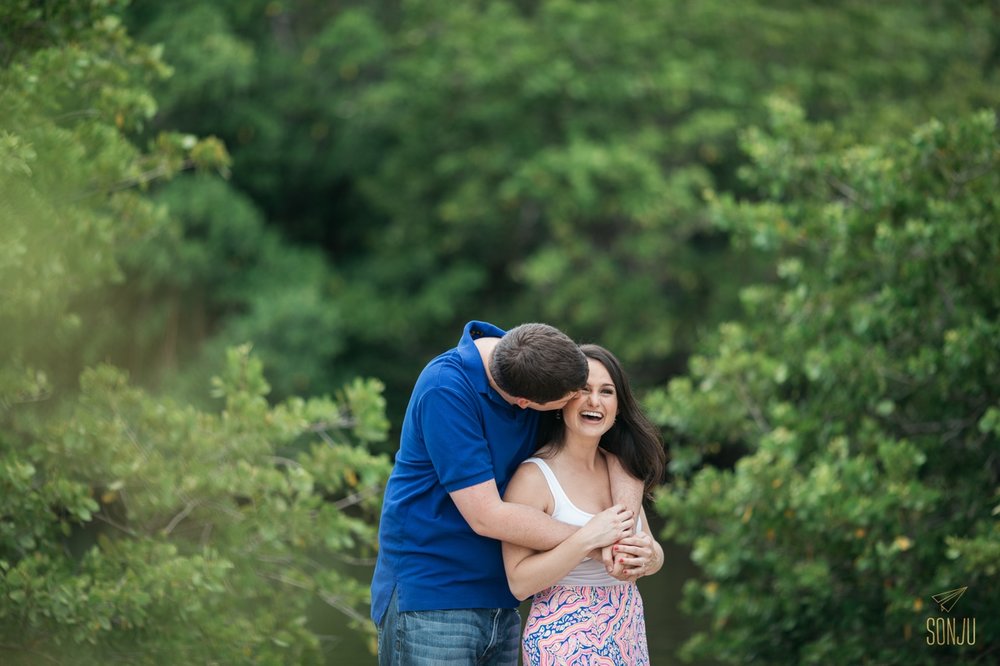  Couple poses for engagement photos at John U Lloyd State Park  