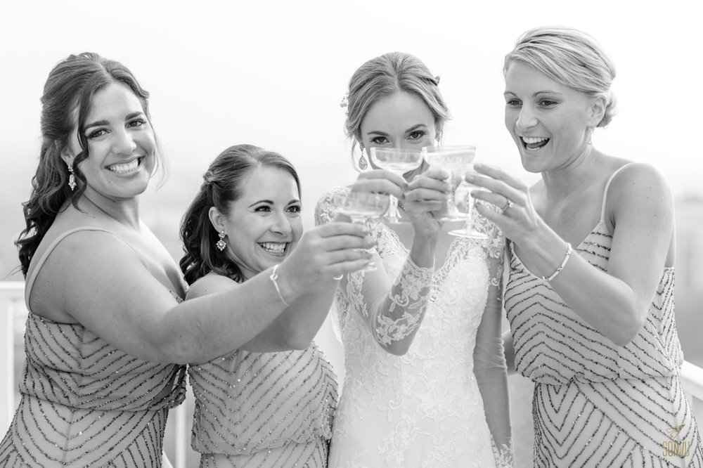  Bride and bridesmaids have a sip of champagne before the wedding ceremony at Stranahan House in Ft Lauderdale&nbsp; 