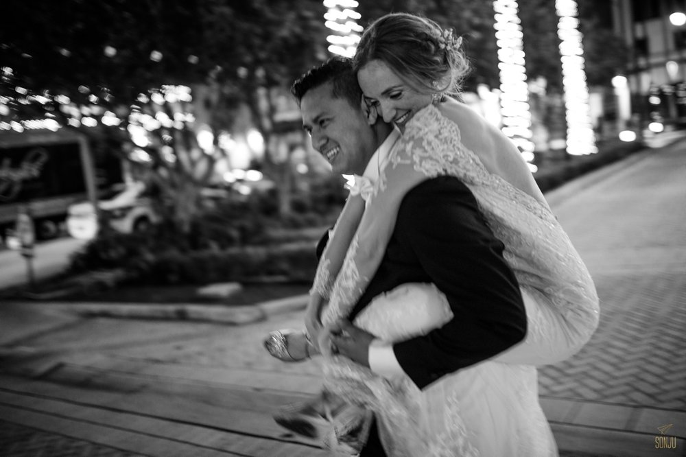  Groom gives bride piggyback at the end of their wedding night in Fort Lauderdale Florida&nbsp; 
