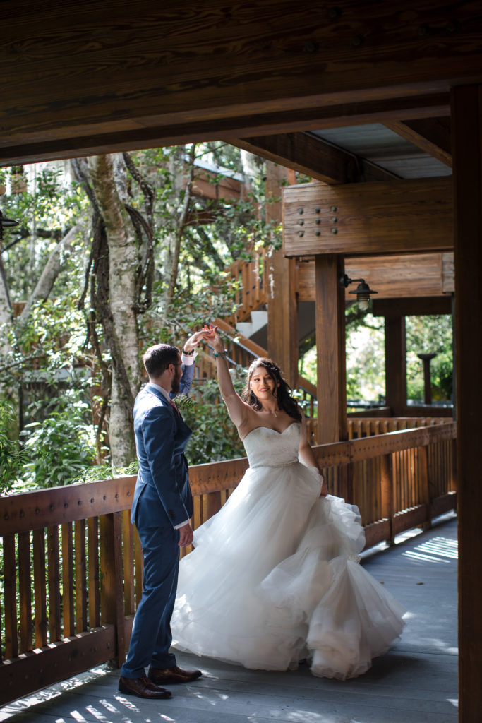 Bride twirls on the deck at Fern Forest for her Broward county elopement