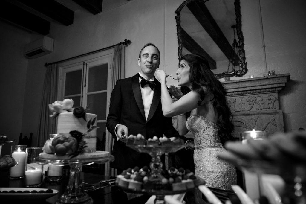 Bride and groom cut cake at Villa Woodbine