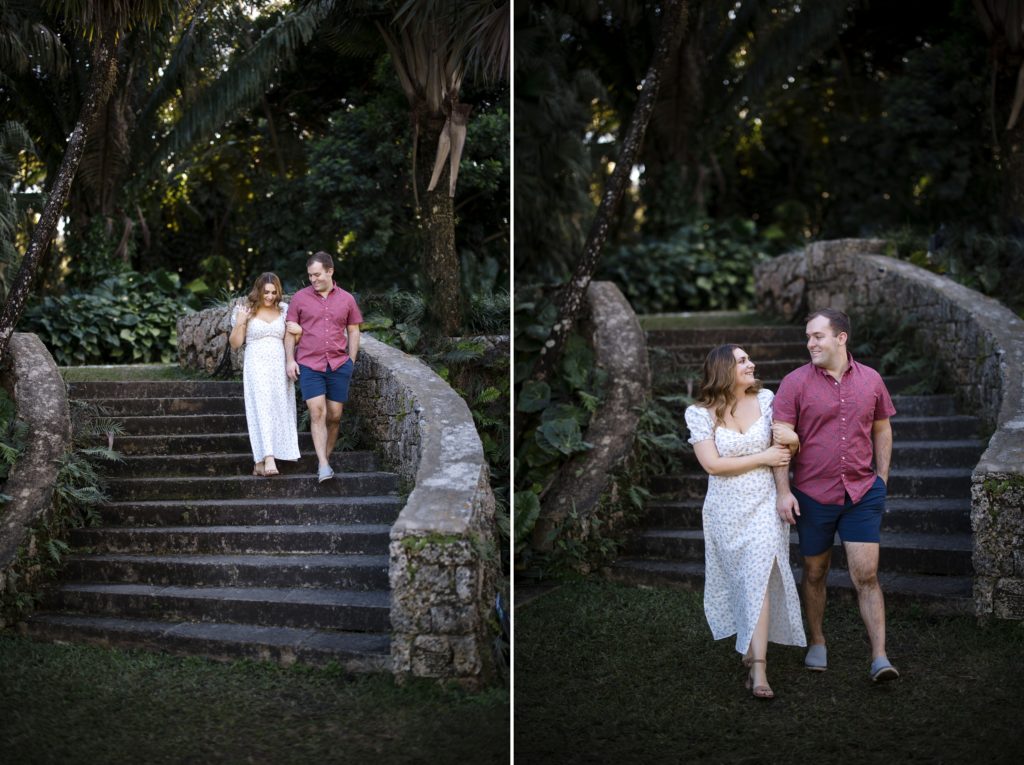 Engaged couple walk down the garden stairs at Fairchild Tropical Gardens
