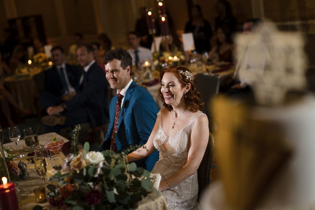 Bride reacts to speeches during the reception at her Ritz Carlton Coconut Grove wedding